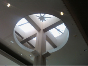 Inside view of a white pyramid style CPI skylight over a store entrance